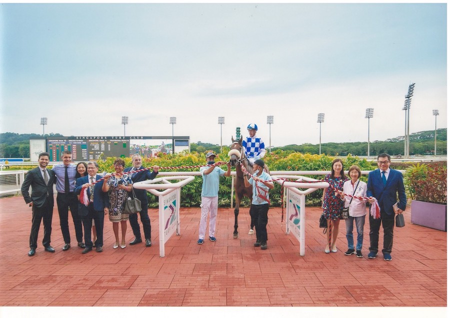 Posing with Singapore Gold Cup 2022 winner Hongkong Great. From left: Stable representative Andre Bally